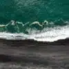 aerial photography of waves crashing on cliff at daytime